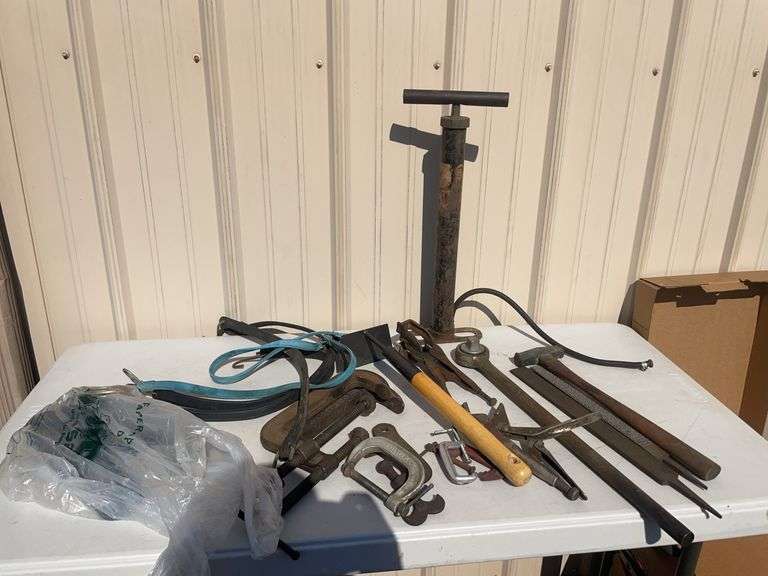 Lot of tools including pump, clamps, file and more