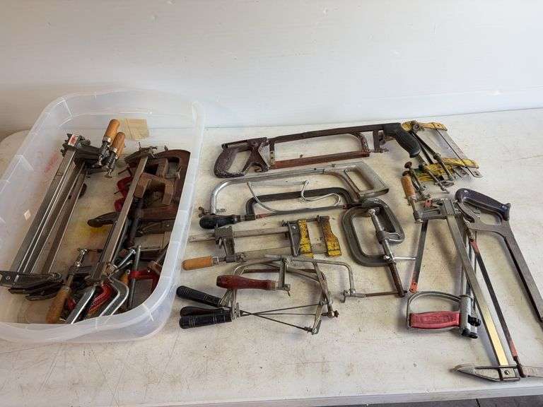 Tote of hand saws and clamps