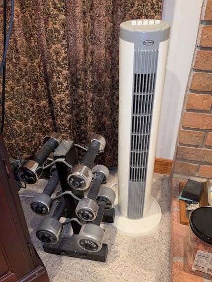 Feature Comforts oscillating fan and Weider dumbbell weights