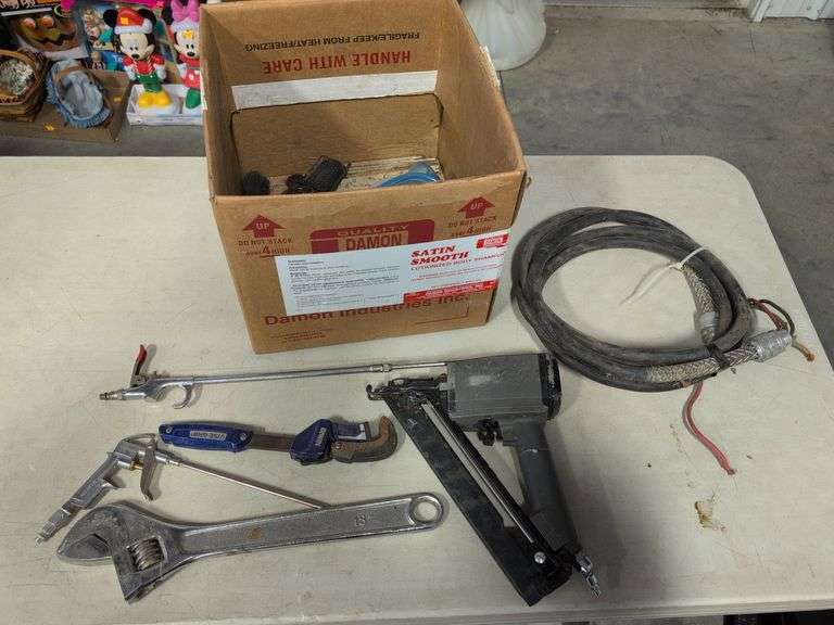 Nail gun, 18" adjustable wrench, and other tools