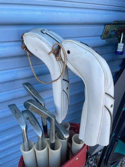 Golf bag with misc. clubs, skis and horseshoe game