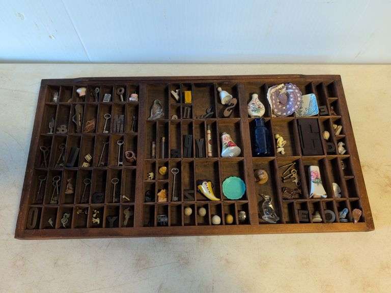 Shadow box with various vintage items - glass figurines, keys, pins, and more