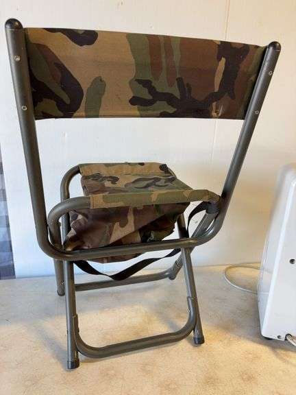 Soleus Air dehumidifier and camo foldable chair