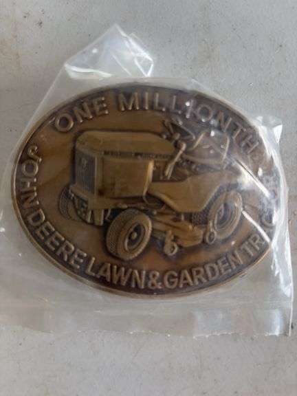(4) John Deere belt buckles