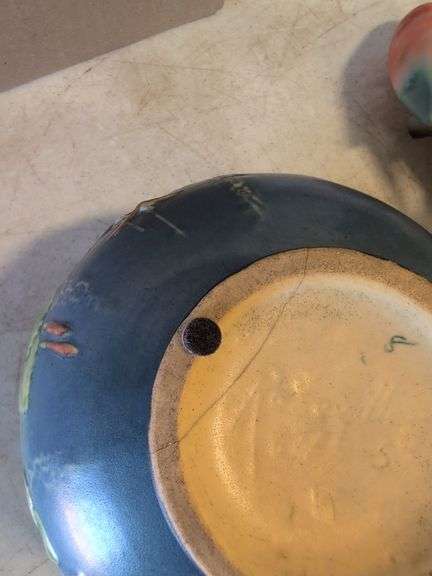 Roseville pottery piece with crack, other pottery, and decor