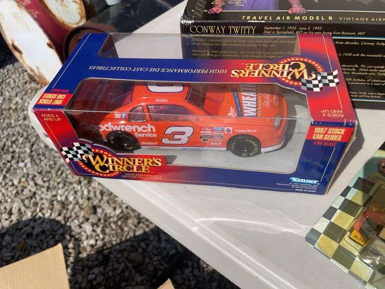 Box of mostly new cars/ toys including hot rod hauler, racing Champions car, BP Chopper Truck and mo