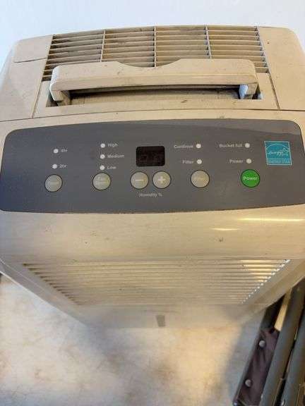 Soleus Air dehumidifier and camo foldable chair