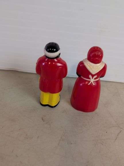 (2) black Americana salt and pepper shakers