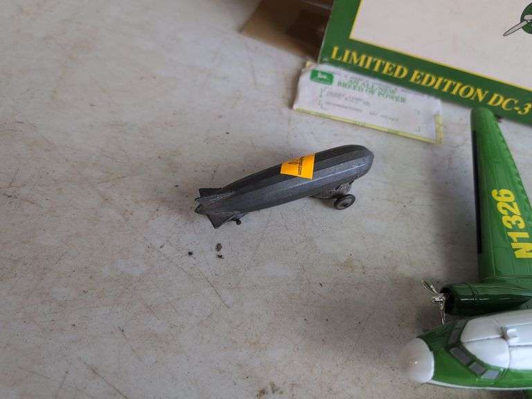 John Deere airplane bank and (2) other metal plane toys