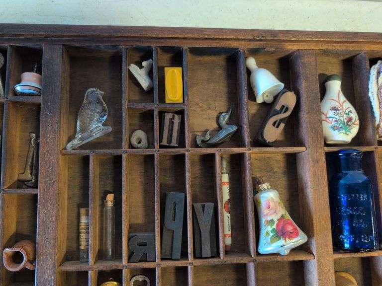 Shadow box with various vintage items - glass figurines, keys, pins, and more