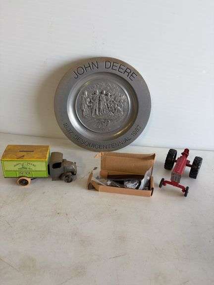 John Deere plate, die-cast model car, and International model tractor