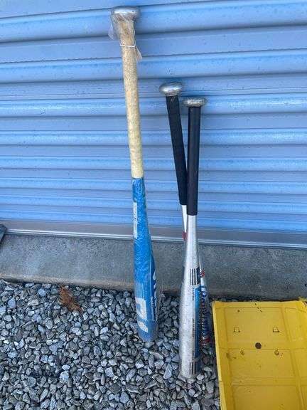 Tonka metal dump truck, (3) aluminum bats, Berlin Flyer wagon rails and misc.