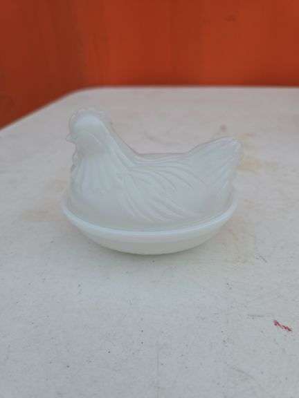 SMALL WHITE HEN ON NEST