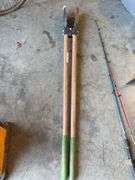 Post hole digger, adze, and (2) fishing poles
