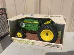 Box of toy tractors/cars/trucks and Ford pocketknife