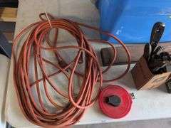 Tote with various tools - extension cord, level, bits, saw, and more