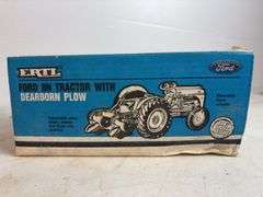 Ford 8N die-cast model tractor with Dearborn plow and other Ford tractor - 1/16 scale, dirty