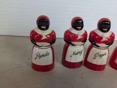 (4) plastic black Americana spice containers