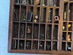 Shadow box with various vintage items - glass figurines, keys, pins, and more