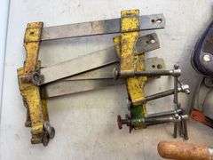 Tote of hand saws and clamps