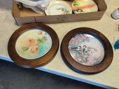 Assortment of decorative plates and glass decor