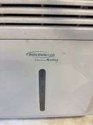 Soleus Air dehumidifier and camo foldable chair