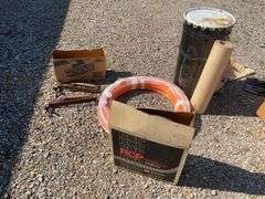 Metal drum, Pex tubing, vacuum hose and Fuller Brikarier brick carrier