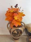 Vases with silk flowers, cups, and more