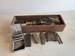 Wooden crate of miscellaneous drill bits