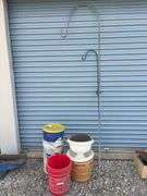 Assortment of buckets, planters and shepherds hook