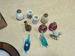 Assortment of decorative plates and glass decor