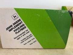 John Deere model milk tanker & John Deere model implement hauling flatbed - 1/64 scale, dirty