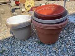 Large lot of outdoor items including fountains, garden hose with reel, plant stand, basket, planters