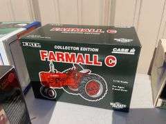 Box of toy tractors/cars/trucks and Ford pocketknife