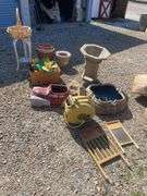 Large lot of outdoor items including fountains, garden hose with reel, plant stand, basket, planters