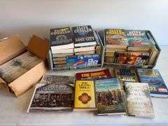 Large assortment of Clive Cussler books and other books