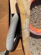 Metal drum, Pex tubing, vacuum hose and Fuller Brikarier brick carrier