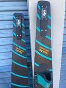 Golf bag with misc. clubs, skis and horseshoe game