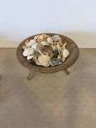 Decorative bowl with stand and shells