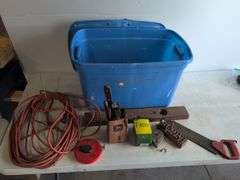 Tote with various tools - extension cord, level, bits, saw, and more
