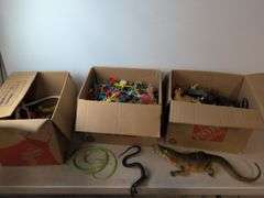 (4) boxes of toy animals