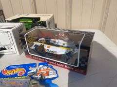 Box of toy tractors/cars/trucks and Ford pocketknife