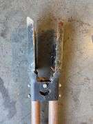 Post hole digger, adze, and (2) fishing poles
