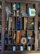 Shadow box with various vintage items - glass figures, print type blocks, and more