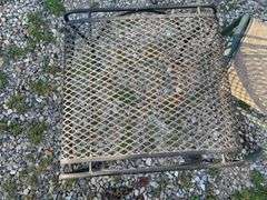 Assortment of garden decor/ plant stands, hanging basket hook and more