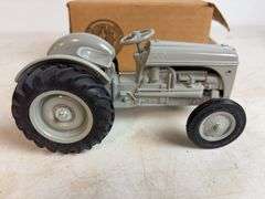 Ford 8N die-cast model tractor with Dearborn plow and other Ford tractor - 1/16 scale, dirty