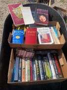Box of books including The Hardy Boys, John Grisham, Technical writing and more