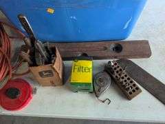 Tote with various tools - extension cord, level, bits, saw, and more