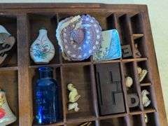 Shadow box with various vintage items - glass figurines, keys, pins, and more