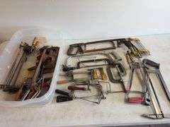Tote of hand saws and clamps